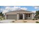 Charming single-story home featuring a two-car garage and a well-maintained, low-maintenance desert landscape at 46904 W Coe St, Maricopa, AZ 85139