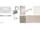 This bathroom features white sink, sleek faucet, cabinet, hardware, light fixture, carpet, and wood look flooring at 47333 W Coe St, Maricopa, AZ 85139