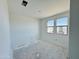 A well-lit bedroom space with bright white walls and large windows at 47333 W Coe St, Maricopa, AZ 85139
