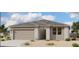 Charming single-story home showcasing desert landscaping and a welcoming entrance at 47333 W Coe St, Maricopa, AZ 85139