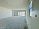 Bright living room with large sliding doors and a view of the outdoor landscape at 47333 W Coe St, Maricopa, AZ 85139