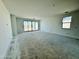 Spacious living room with sliding glass doors to the backyard, bathed in natural light at 47333 W Coe St, Maricopa, AZ 85139