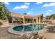 Backyard featuring a pool, patio area, and outdoor kitchen, perfect for relaxing and entertaining at 4809 E Red Range Way, Cave Creek, AZ 85331