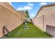 Spacious backyard with artificial turf, perfect for outdoor games and activities at 4809 E Red Range Way, Cave Creek, AZ 85331