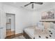 Cozy bedroom with warm accents, ensuite bathroom, and wood flooring at 4809 E Red Range Way, Cave Creek, AZ 85331