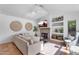 Cozy living room featuring a fireplace, built-in shelves, and decorative accents at 4809 E Red Range Way, Cave Creek, AZ 85331