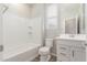 Bright bathroom features a shower-tub combo, white vanity, and modern fixtures at 4833 S Ferric --, Mesa, AZ 85212