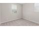 Bedroom with carpeted floors, neutral walls, and natural lighting through a bright window at 4833 S Ferric --, Mesa, AZ 85212