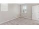 Bedroom featuring two windows and carpeted floors with natural light at 4833 S Ferric --, Mesa, AZ 85212