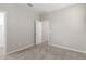 Empty bedroom with carpet and neutral walls and a white door at 4833 S Ferric --, Mesa, AZ 85212
