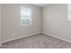 Neutral bedroom with carpeted floors and a bright window letting in natural light at 4833 S Ferric --, Mesa, AZ 85212
