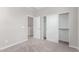 Carpeted bedroom with closet and two white doors and neutral walls at 4833 S Ferric --, Mesa, AZ 85212