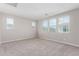 Spacious bedroom featuring plush carpeting, light-filled windows, and neutral color palette at 4833 S Ferric --, Mesa, AZ 85212
