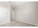 A bedroom with gray carpet, slider closet and a doorway at 4833 S Ferric --, Mesa, AZ 85212