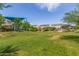 A spacious community park with lush green grass, shaded playground, and an outdoor pavilion, creating a vibrant recreational space at 4833 S Ferric --, Mesa, AZ 85212