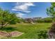 A large open grass area with mature landscaping and a community outdoor pavilion, creating a tranquil recreational space at 4833 S Ferric --, Mesa, AZ 85212