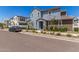 Charming two-story home featuring a combination of gray and brown siding with manicured landscaping at 4833 S Ferric --, Mesa, AZ 85212