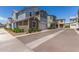 View of a two-story home featuring gray and brown siding, with an attached garage at 4833 S Ferric --, Mesa, AZ 85212