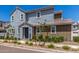 Charming two-story home featuring a combination of gray and brown siding with manicured landscaping at 4833 S Ferric --, Mesa, AZ 85212
