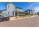 Charming two-story home featuring a combination of gray and brown siding with manicured landscaping at 4833 S Ferric --, Mesa, AZ 85212