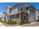 View of a two-story home featuring gray and brown siding, with an attached garage at 4833 S Ferric --, Mesa, AZ 85212