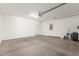 View of the garage interior showing the floor, water heater, and entrance door at 4833 S Ferric --, Mesa, AZ 85212