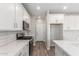 Contemporary kitchen boasts white cabinetry, stainless steel appliances, and sleek countertops at 4833 S Ferric --, Mesa, AZ 85212