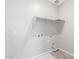 Bare laundry room features lots of space and a storage shelf at 4833 S Ferric --, Mesa, AZ 85212
