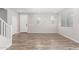 View of the light-filled living room with wood-look flooring and multiple windows at 4833 S Ferric --, Mesa, AZ 85212