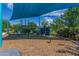 A community playground featuring a large shade and various climbing structures and play equipment designed for Gathering fun at 4833 S Ferric --, Mesa, AZ 85212