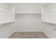 Spacious walk-in closet with carpet, shelving, and plenty of storage space at 4833 S Ferric --, Mesa, AZ 85212