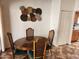 Elegant dining room with a wooden table and upholstered chairs, ideal for Gathering meals at 520 S Evergreen Rd, Tempe, AZ 85288