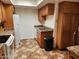Efficient kitchen with white appliances, granite countertops, and wood cabinets at 520 S Evergreen Rd, Tempe, AZ 85288