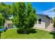 Backyard features playhouse on artificial grass and mature shade trees in a private, fenced yard at 5425 E Avalon Dr, Phoenix, AZ 85018