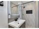 Contemporary bathroom with a sleek vanity, modern faucet, and a tiled shower with a built-in niche at 5425 E Avalon Dr, Phoenix, AZ 85018