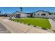 Beautiful home exterior with brick accents, manicured lawn, and modern design elements at 5425 E Avalon Dr, Phoenix, AZ 85018