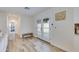 Bright foyer featuring wood-look tile flooring and white interior doors with sidelights at 5425 E Avalon Dr, Phoenix, AZ 85018