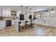 Bright kitchen with a large island, modern pendant lights, and stainless steel appliances at 5425 E Avalon Dr, Phoenix, AZ 85018