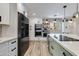 Modern kitchen with stainless steel appliances, white cabinets, and a tiled backsplash at 5425 E Avalon Dr, Phoenix, AZ 85018