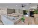 Open living room features a cozy fireplace and a large sectional sofa at 5425 E Avalon Dr, Phoenix, AZ 85018