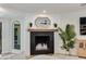 Close-up on living room featuring a fireplace with stylish decor and ample natural light at 5425 E Avalon Dr, Phoenix, AZ 85018