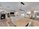 Open living space with dining area, fireplace, and modern kitchen with an island at 5425 E Avalon Dr, Phoenix, AZ 85018