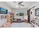 Inviting playroom with a ceiling fan, natural light and fun toys and books for children to learn and grow at 5425 E Avalon Dr, Phoenix, AZ 85018