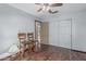 Bedroom features wood-look floors, ceiling fan, and sliding-door closet for convenient storage at 610 S St Paul --, Mesa, AZ 85206