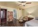 Bedroom featuring dark wood floors, vintage furniture, and decorative wallpaper at 610 S St Paul --, Mesa, AZ 85206