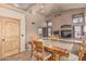 Eat-in kitchen featuring wood cabinets, bar seating, and is open to the Gathering room with fireplace at 610 S St Paul --, Mesa, AZ 85206