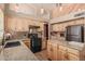 Spacious kitchen features stainless steel appliances, granite counters, and wood cabinets at 610 S St Paul --, Mesa, AZ 85206