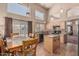 Bright eat-in kitchen featuring stainless steel appliances, granite countertops, an island, and a sliding door at 610 S St Paul --, Mesa, AZ 85206