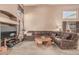 Comfortable living room featuring a plush sectional sofa, entertainment center, and abundant natural light at 610 S St Paul --, Mesa, AZ 85206