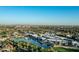 Breathtaking aerial view of a luxury community with a water feature and golf course at 6142 E Alta Hacienda Dr, Scottsdale, AZ 85251